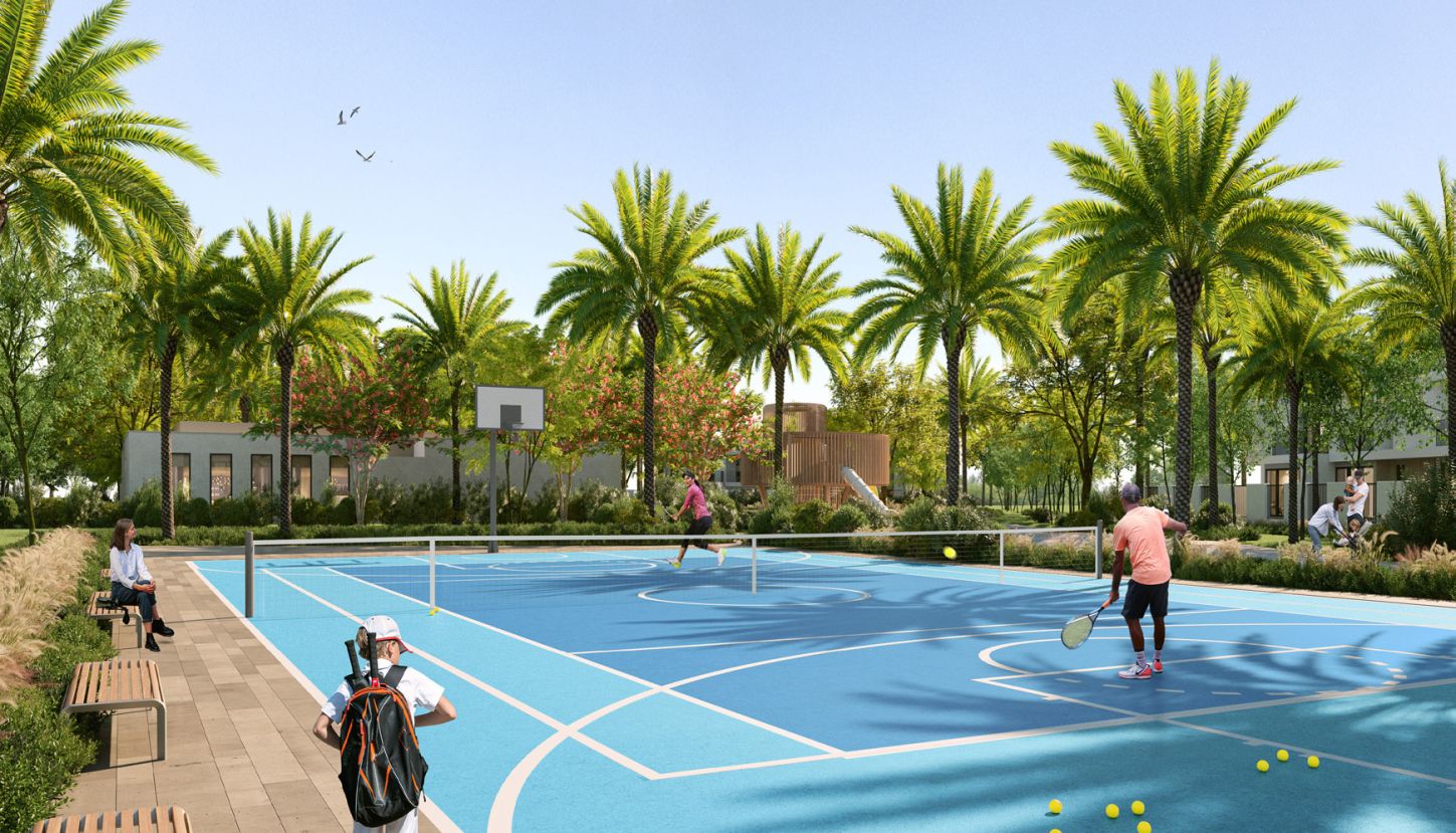 People playing tennis at Anya 2 in the sports village